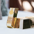 Load image into Gallery viewer, A small stack of Gold Bar Whiskey