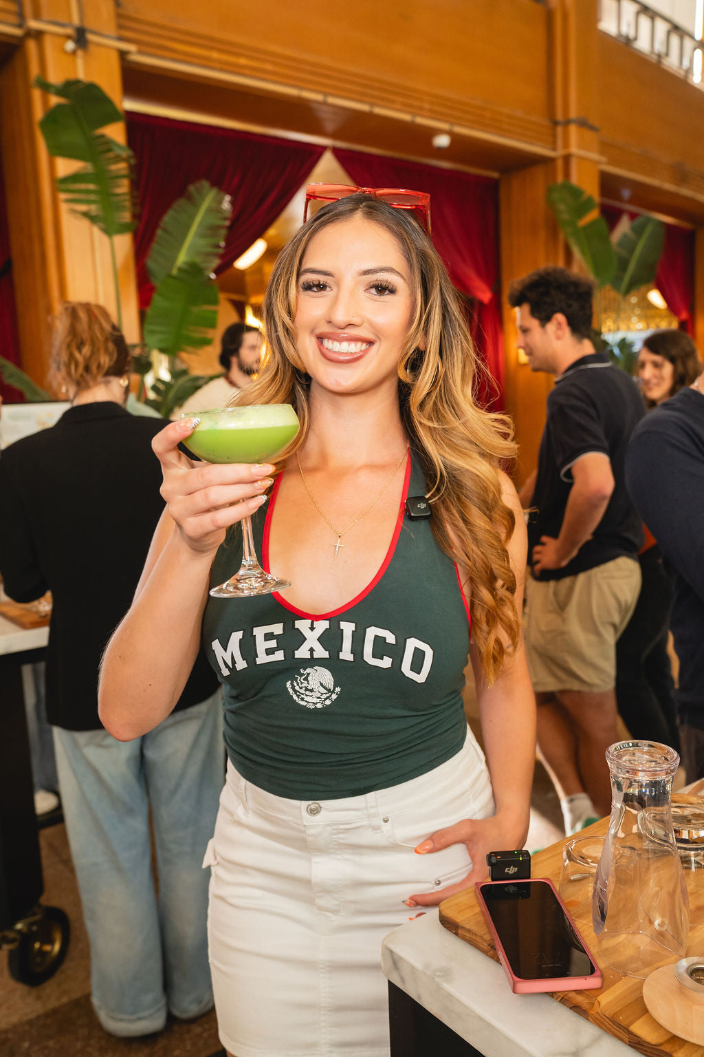 A guest enjoying our matcha sour from our soccer themed cocktail class